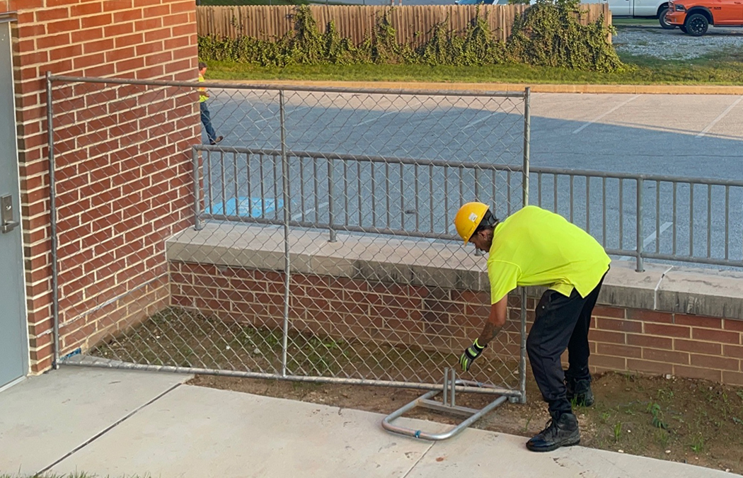 Installing panel fence on metal stands